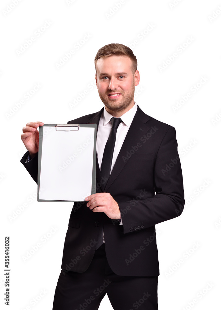 Attractive man in suit holding a blank sheet of white paper and smiling, isolated on white background Attractive man in suit holding a blank sheet of white paper and smiling, isolated on white background