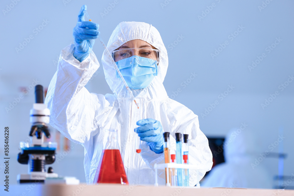 Scientist working with sample in laboratory Scientist working with sample in laboratory