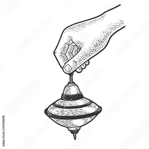 Hand with spinning top toy sketch engraving vector illustration. T-shirt apparel print design. Scratch board imitation. Black and white hand drawn image.