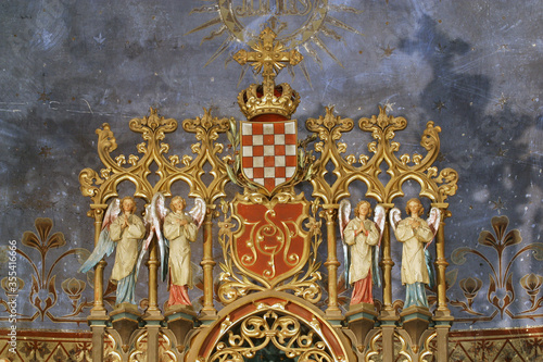 Coat of arms of the Triune Kingdom of Croatia, Slavonia and Dalmatia surrounded by angels, high altar in the parish church of St. Joseph in Grubisno Polje, Croatia