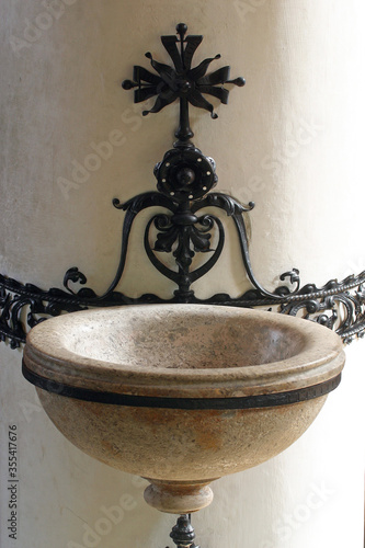 Fotografie Holy water font in church of Saint Catherine of Alexandria in Zagreb, Croatia