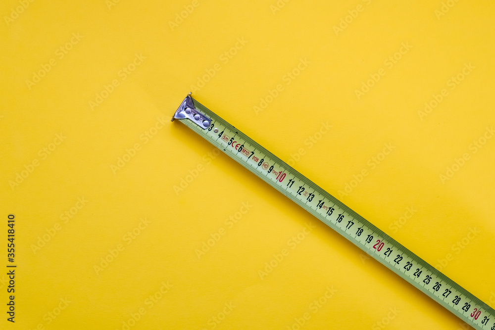 Measuring tape on yellow background. Measuring tape on yellow background.