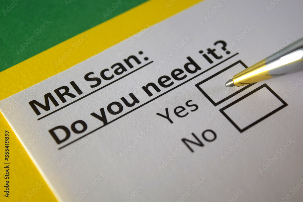 One person is answering question about MRI scan. One person is answering question about MRI scan.