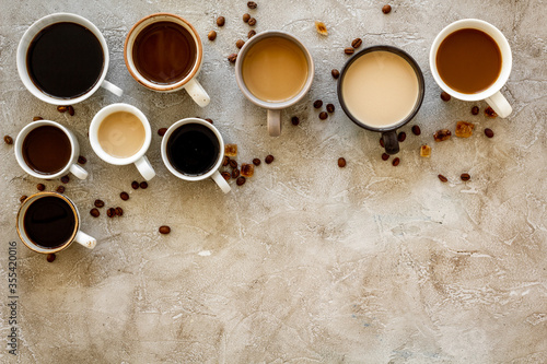 Coffee addiction. Many of cups on hrey table top view space for text photo