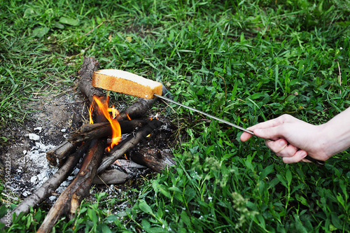 piece of bread fried at the stake put on a skewer © Богдан Стеблянко