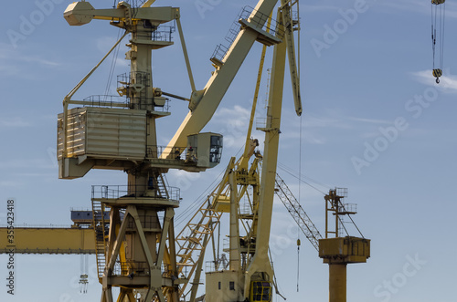 SHIPYARD AND SEAPORT - A set of port cranes at the port repair and reloading quays