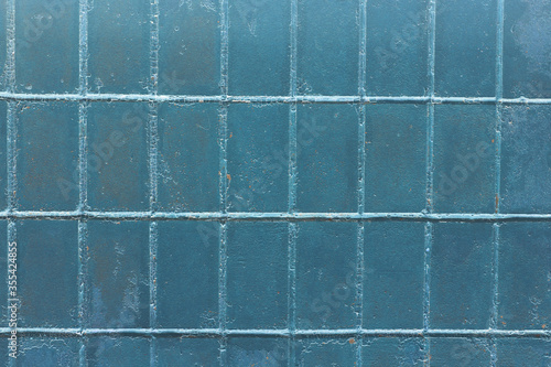 Beautiful vintage blue background with old blue paint with a rough surface  streaks and uneven texture of blue paint on an old rough surface