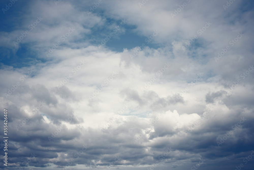 Tinted dark blue sky and clouds