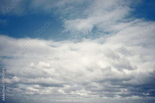 Fototapeta Naklejka Na Ścianę i Meble -  Tinted dark blue sky and clouds