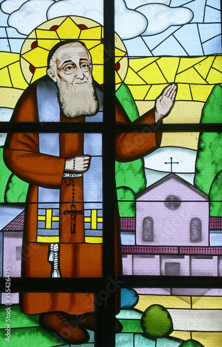 Saint Leopold Mandic, stained glass window at Our Lady of Miracles Parish Church in Ostarije in Croatia photo