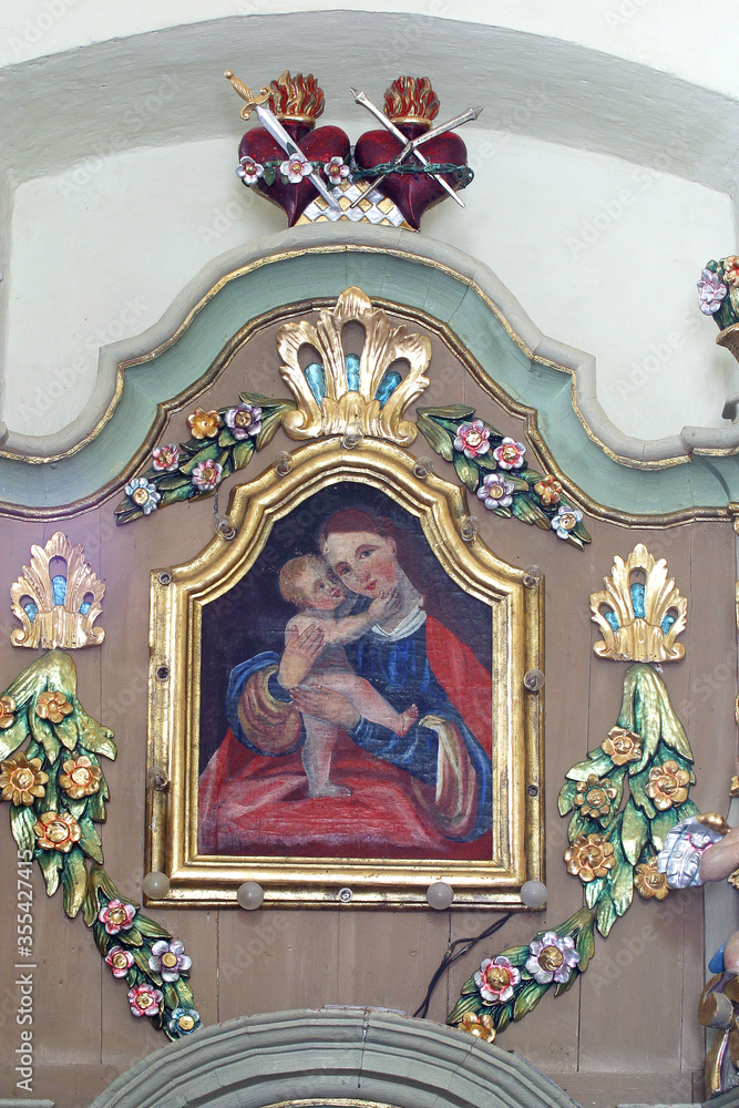 Obraz premium Virgin Mary with baby Jesus, altarpiece at the altar Our Lady of Sorrows at St. Peter's Parish Church in Sveti Petar Mreznicki, Croatia