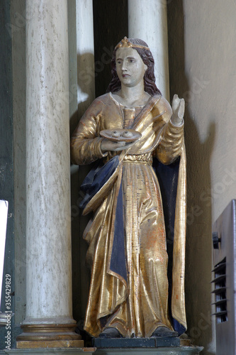 St. Lucia, statue on the altar of St. Barbara in the parish church of St. Anthony the Hermit in Slavetic, Croatia photo
