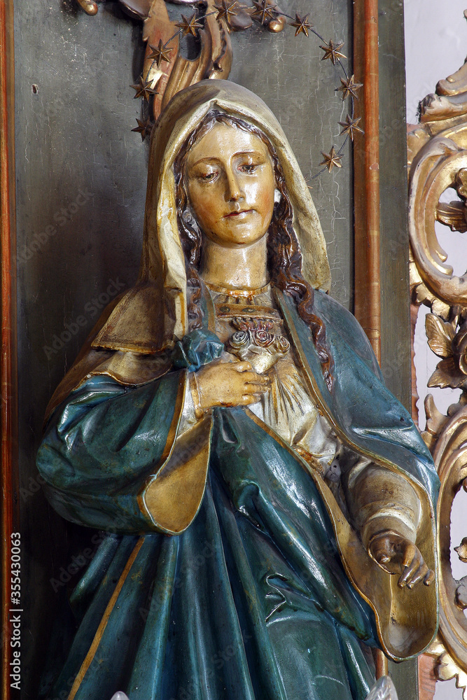Obraz premium Immaculate Heart of Mary statue on the high altar at St. Anne's Parish Church in Sveta Jana, Croatia