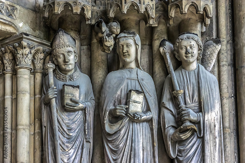 Saint-Germain-l'Auxerrois Church situated in Paris, France. Founded in 7 century, church rebuilt many times over several centuries. Sculptures at the entrance to the church.