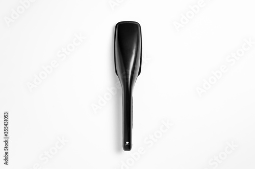 Black brush coarse for cleaning clothes from dust isolated on white background.High-resolution photo.