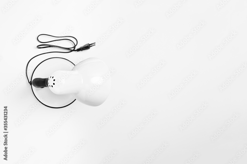 Lamp holder with switch on-off, isolated on white background. High-resolution photo.