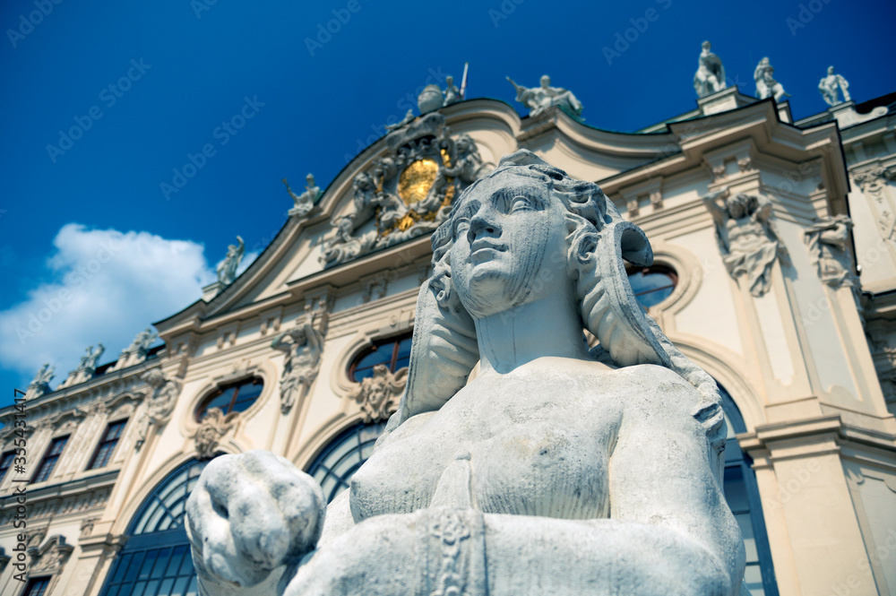 VIENNA, AUSTRIA - AUGUST 27, 2019. Woman statue on the background of the Belvedere Palace in Vienna