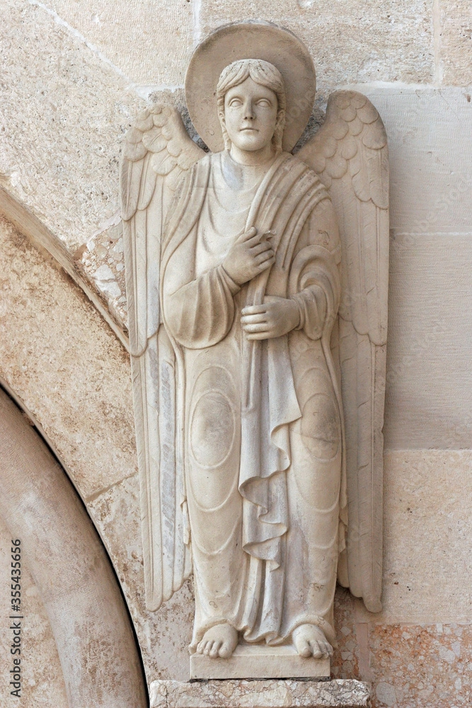 Angel, statue on the portal Cathedral of St Anastasia in Zadar, Croatia