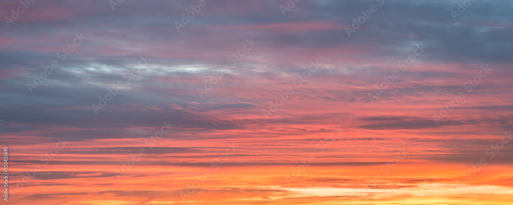 Multi colored textured sky during sunset. Suitable as background or wallpaper.