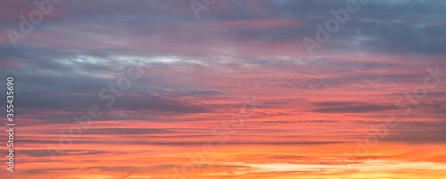 Multi colored textured sky during sunset. Suitable as background or wallpaper. © Menyhert
