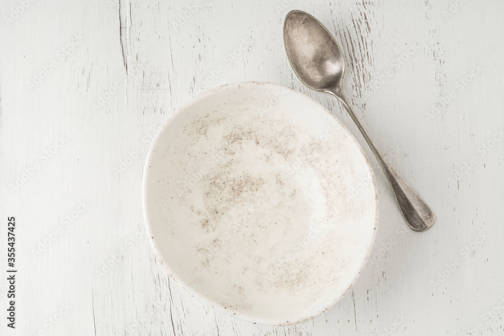 empty and clean bowl and spoon on a table