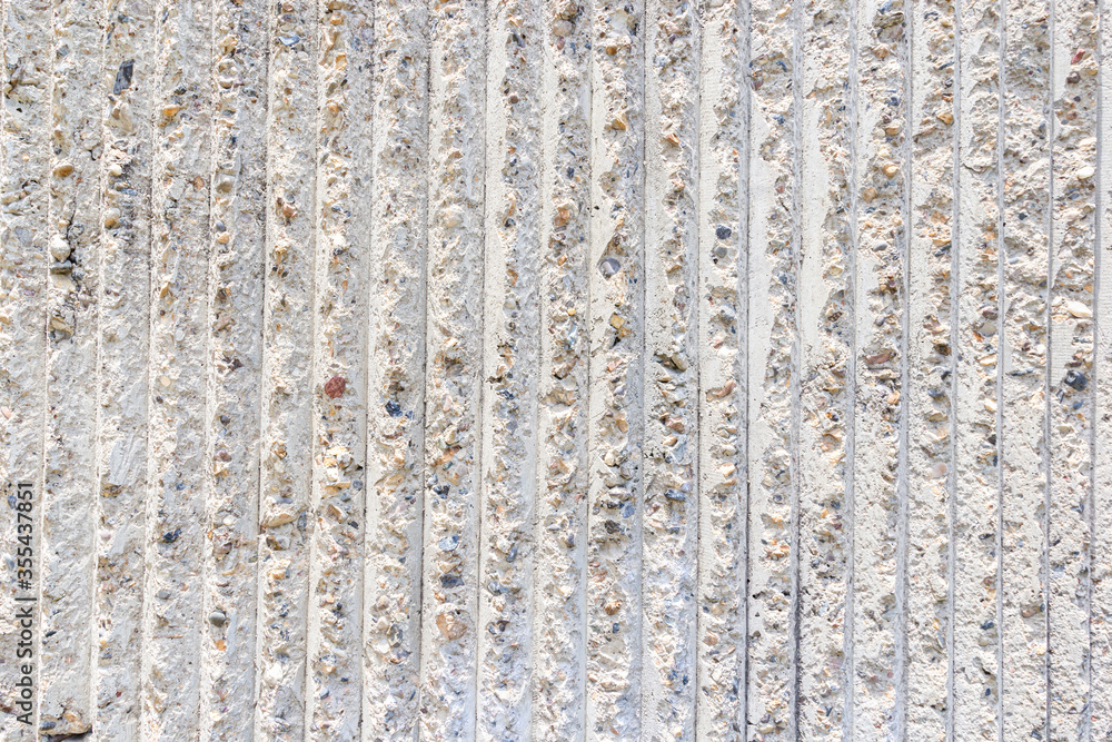 Cement wall texture with vertical pattern on day noon light for interior or exterior brick wall building and decoration texture background. Cement wall texture with vertical pattern on day noon light for interior or exterior brick wall building and decoration texture background.