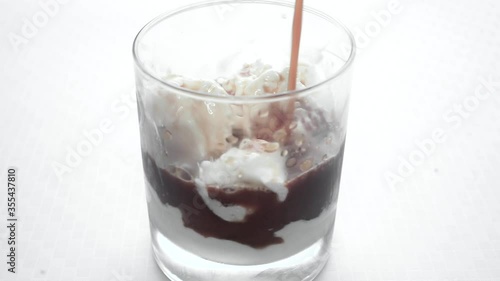 Wallpaper Mural Pouring coffee over ice cream in a glass, affogato sweet barista drink  Torontodigital.ca