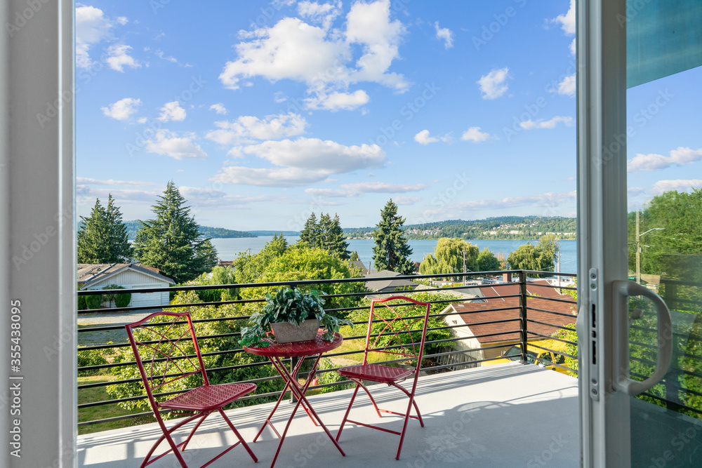 Open door to a balcony with beautiful Lake Washington view - obrazy, fototapety, plakaty 