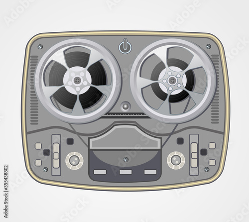 Vintage retro style reel to reel tape deck. Obsolete tape recorder with two bobbins on  background