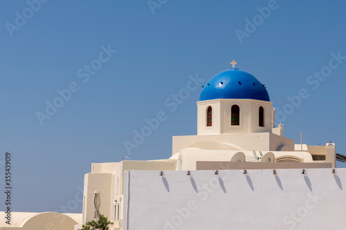 Blue dome churches on the Caldera at Oia on the Greek Island of Santorini.