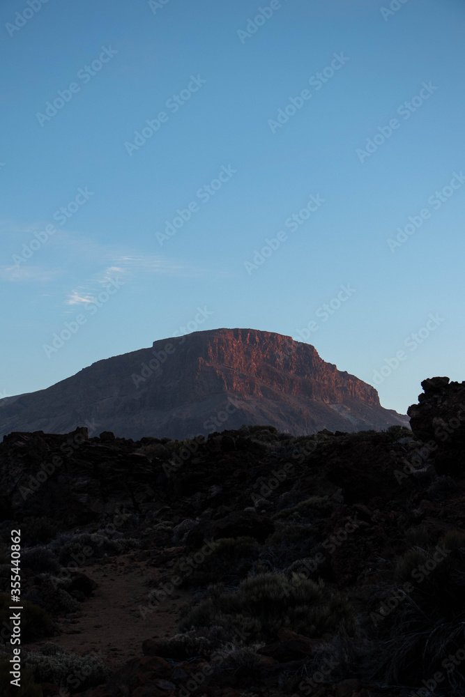 Mountain colored red in the sunset inside El Teide national park on Tenerife, Spain