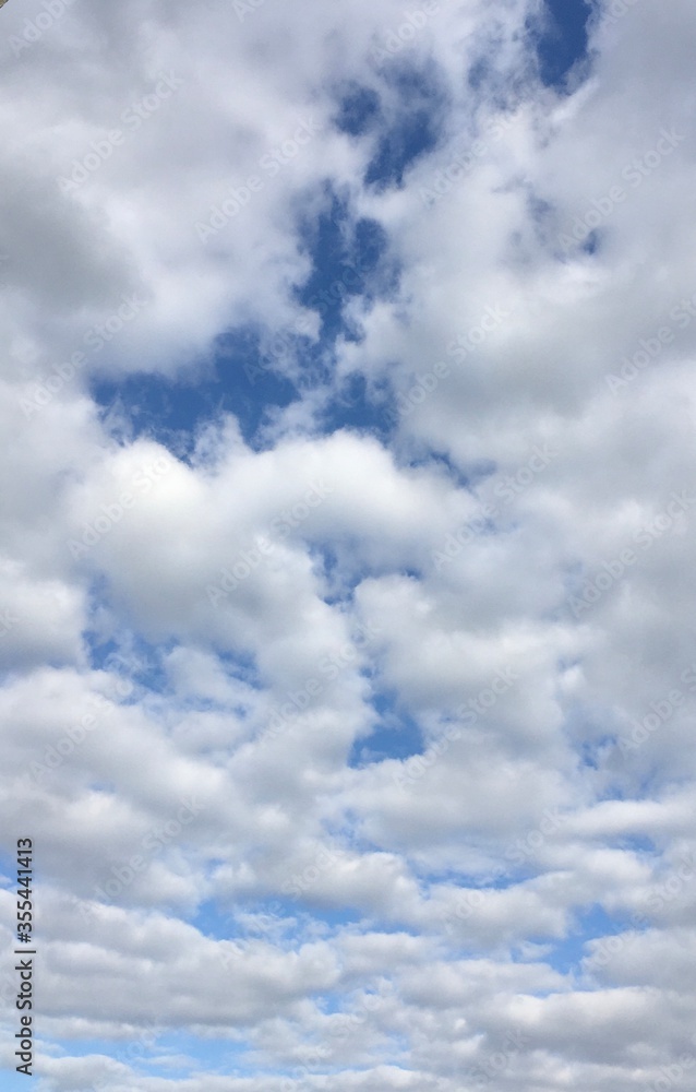 Blue sky with rolling white clouds Blue sky with rolling white clouds