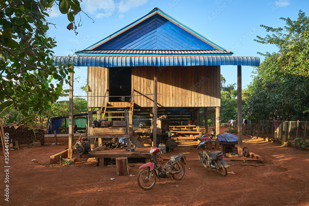 Khmer wooden house in a cambodian rural village Khmer wooden house in a cambodian rural village