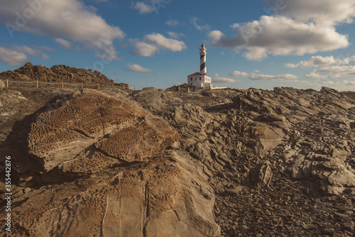 lighthouse at the morning in a sunny winter day in menorca, spain