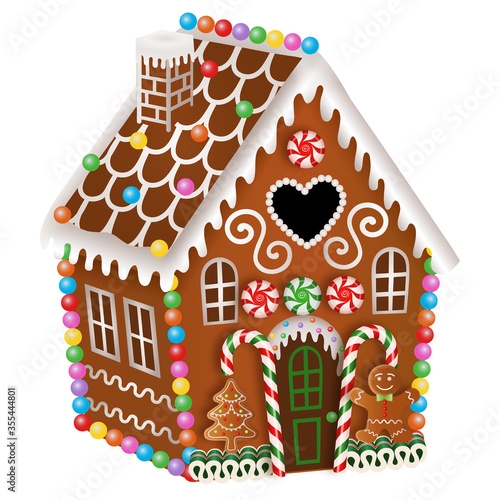 gingerbread house with christmas candies, gingerbread man and gingerbread tree