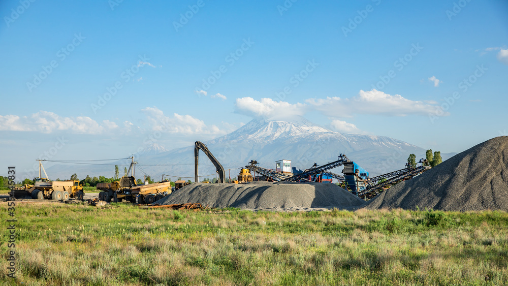 Fototapeta premium Construction machine and building material