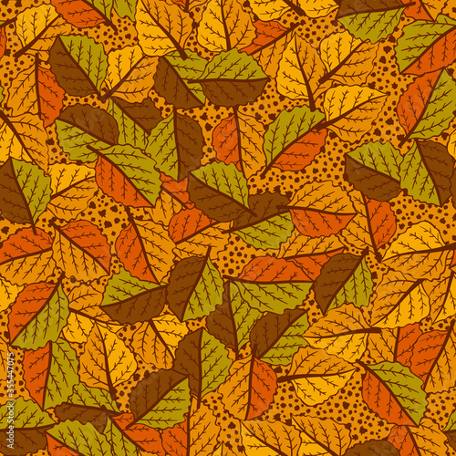 Seamless pattern. Chaotic texture from variegated autumn leaves. Orange, brown, yellow.