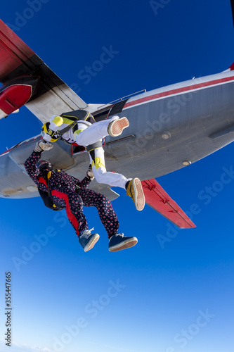 Fototapeta Naklejka Na Ścianę i Meble -  Sports parachutist build a figure in free fall. Extreme sport concept.