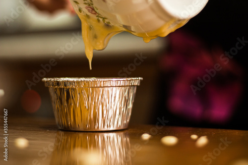 Unrecognizable person preparing cupcakes