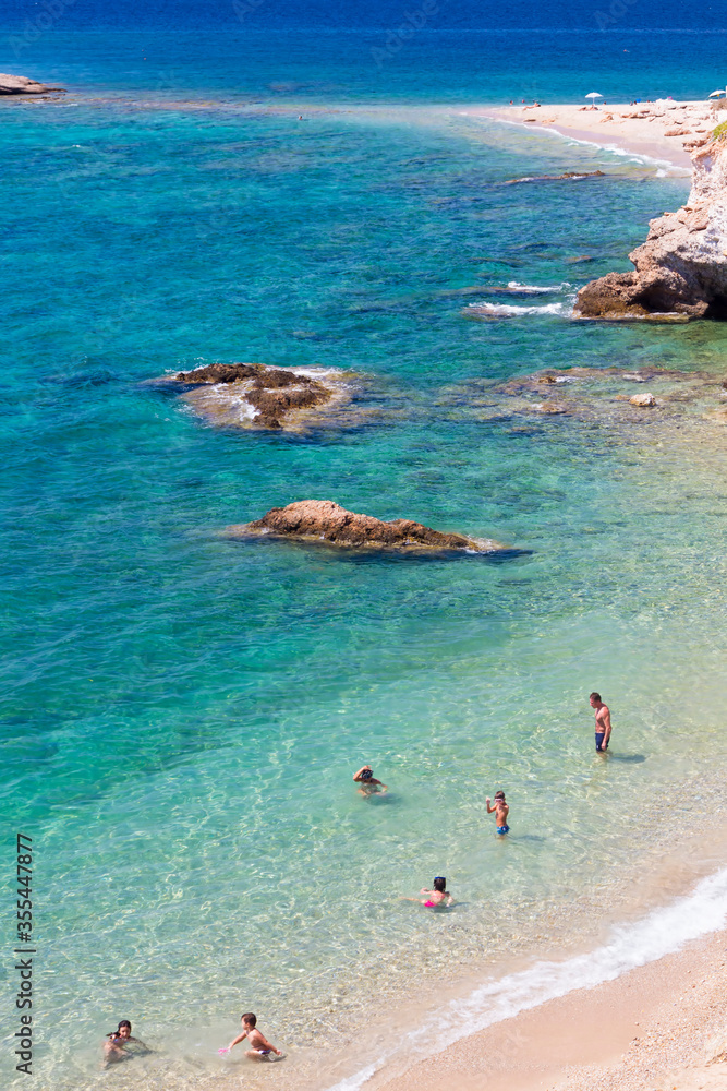 Obraz premium Sandy beach and crystal turquoise colors in a shore in Attica, near Athens, Greece.