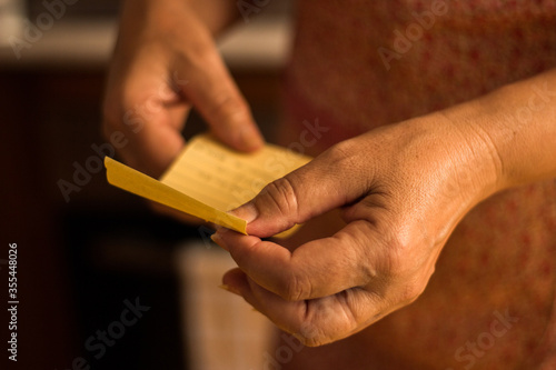 Unrecognizable person taking shopping list