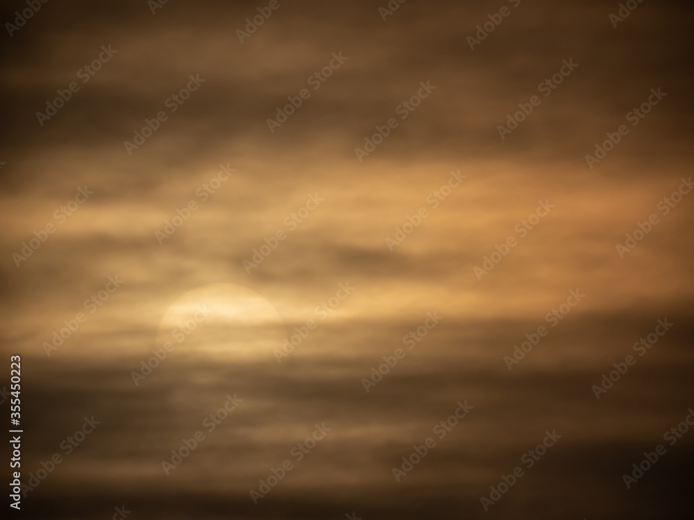 Naklejka premium dark clouds covering the cold sun
