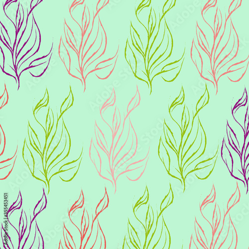 Colored leaves on mint background