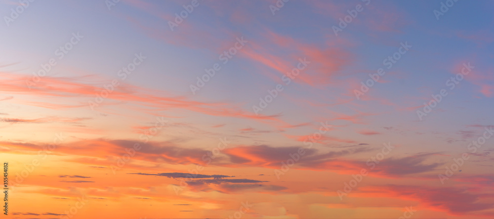 panorama of a blue-pink sunset with clouds of pink hues. sunset on the horizon. photo for the banner. space for text. panorama of a blue-pink sunset with clouds of pink hues. sunset on the horizon. photo for the banner. space for text.