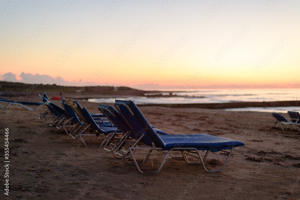 Sunbed near sea at pink calm dusk Sunbed near sea at pink calm dusk