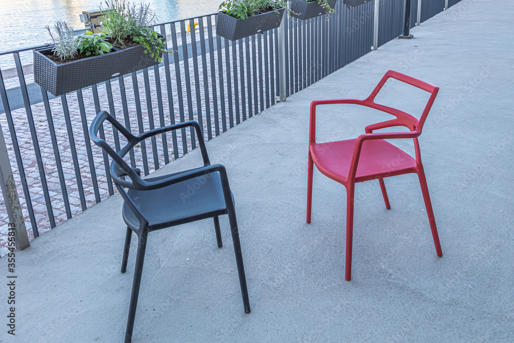 Red and black stool. Outdoor, summer terrace
