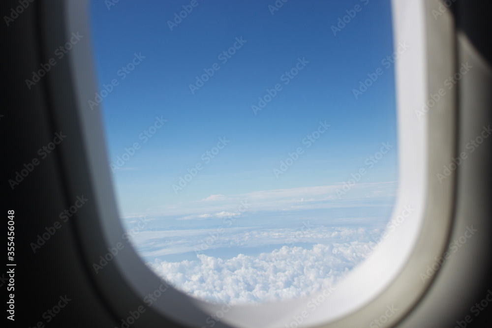 airplane wing in flight and clear blue sky
