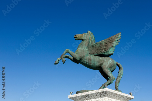 Pegasus, the mythological winged horse of hero Bellerophontes, an emblematic figure of ancient Greek mythology. photo