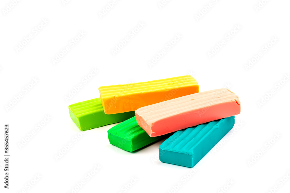 Сolorful plasticine isolated on white background. Space for text Сolorful plasticine isolated on white background. Space for text