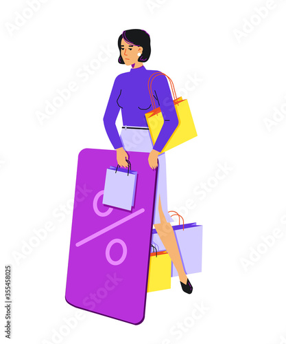 Tired woman with a bunch of purchases and a huge plastic discount card. The woman is upset. She is uncomfortable holding purchases and a plastic card at the same time.